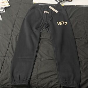 Fear of God Black Sweatpants with Cream Logo